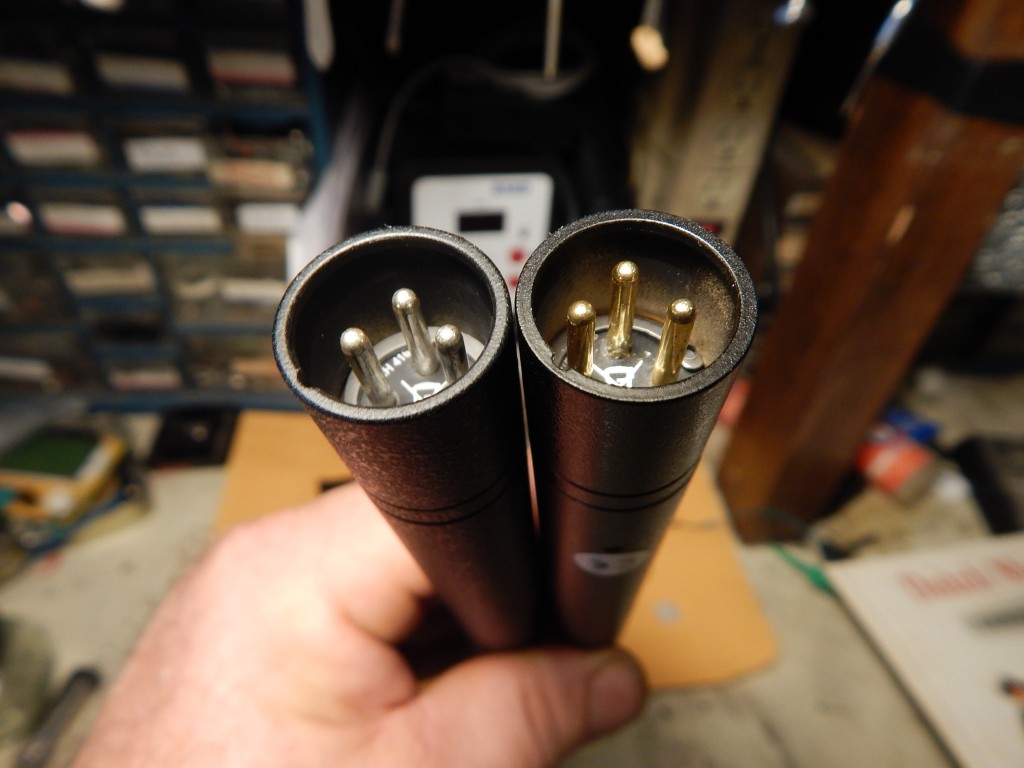 Real 416 (L) and fake (R). Notice paint underspray inside XLR, and silver vs gold pins. 